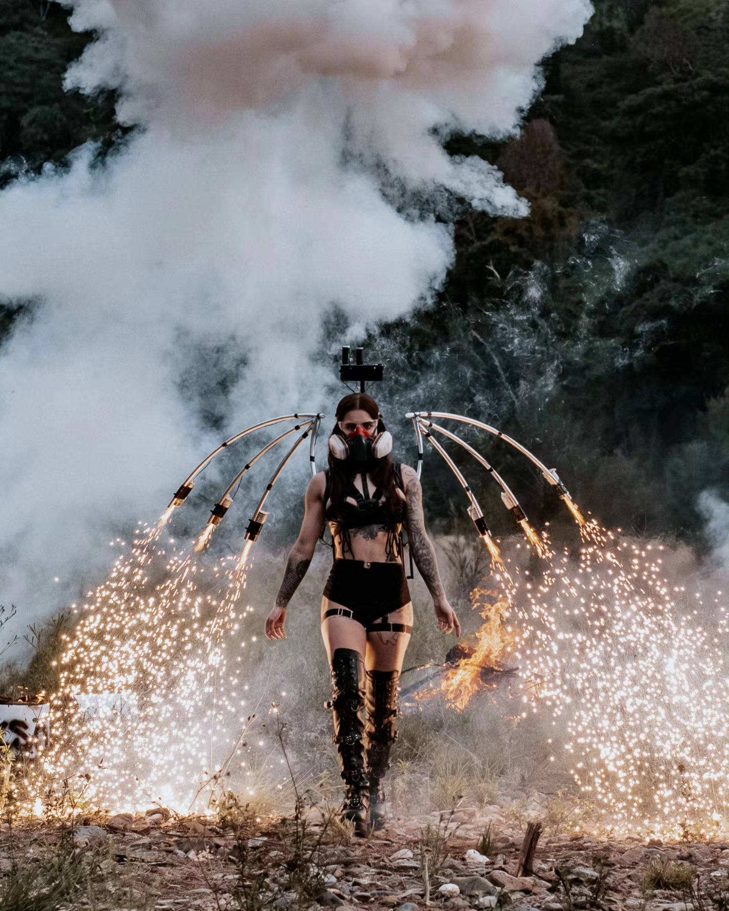 Performer wearing a wearable close proximity pyrotechnic wing rig