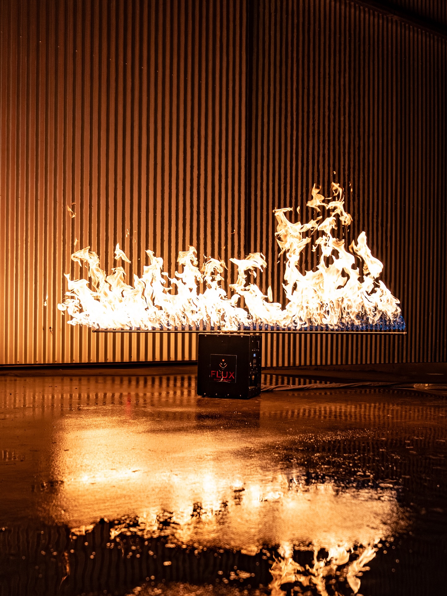 Flux SFX flame bar effect reflected on a wet floor at night
